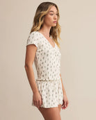 Woman wearing a floral pajama set 