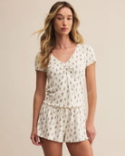 Woman wearing a floral pajama set 
