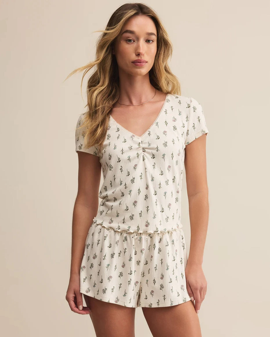 Woman wearing a floral pajama set 