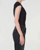 woman wearing a black bodysuit with a corset design by Agolde