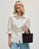 brown woven crossbody or handbag