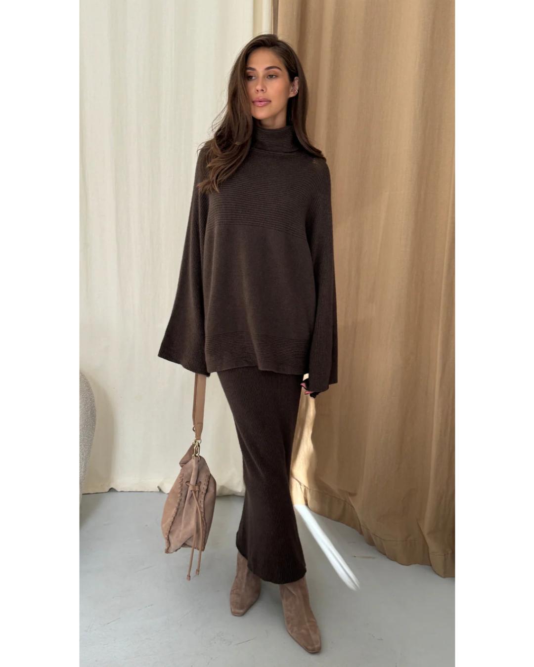 dark brown turtleneck sweater with an oversized look