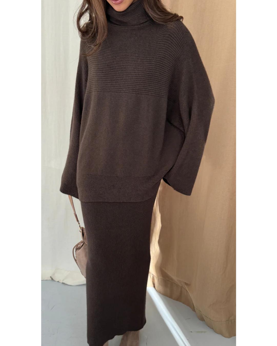 dark brown turtleneck sweater with an oversized look