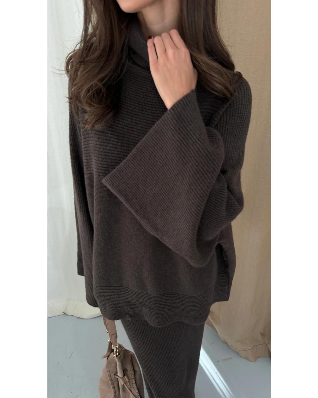 dark brown turtleneck sweater with an oversized look