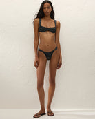 black bikini bottom with cream polka dots