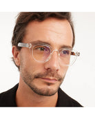 eyeglasses with a clear frame and tortoise arms