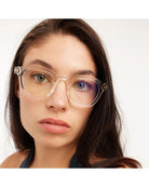 eyeglasses with a clear frame and tortoise arms