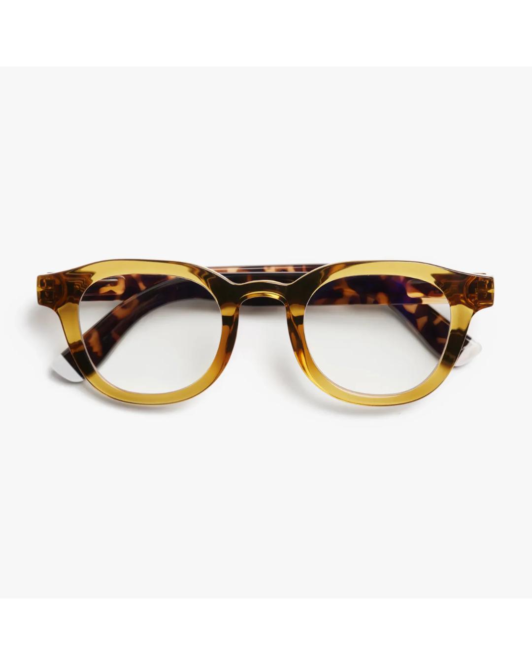 eyeglasses with a brown/olive frame and tortoise arms
