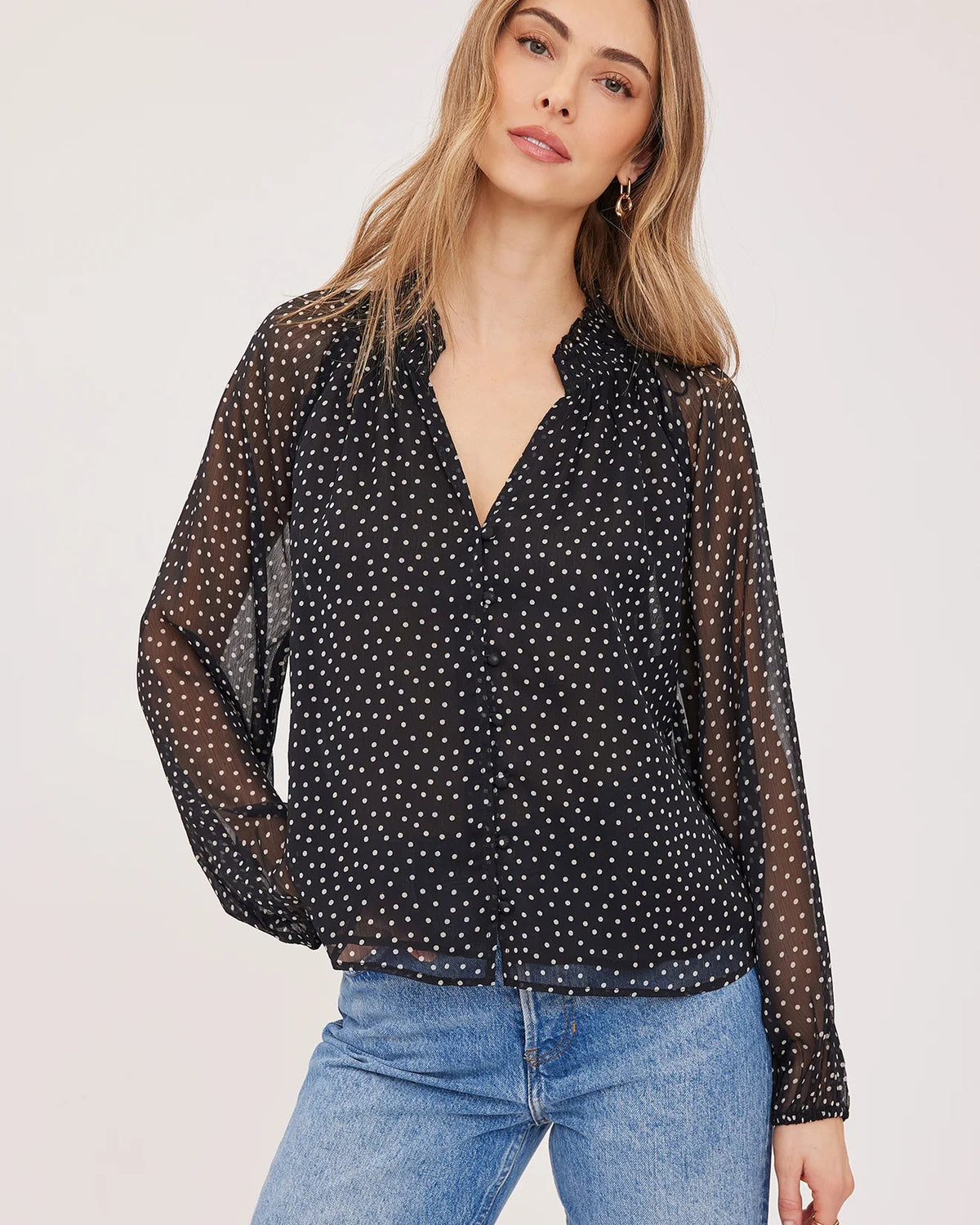 black blouse with white polka dots