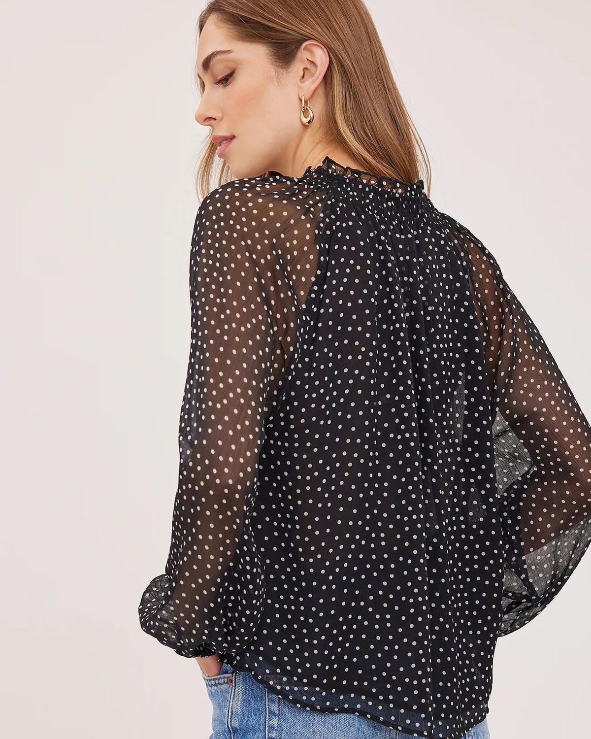 black blouse with white polka dots