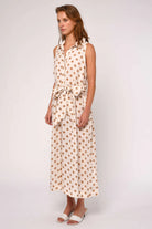 midi polka dot dress in cream and brown with a tie around the waist