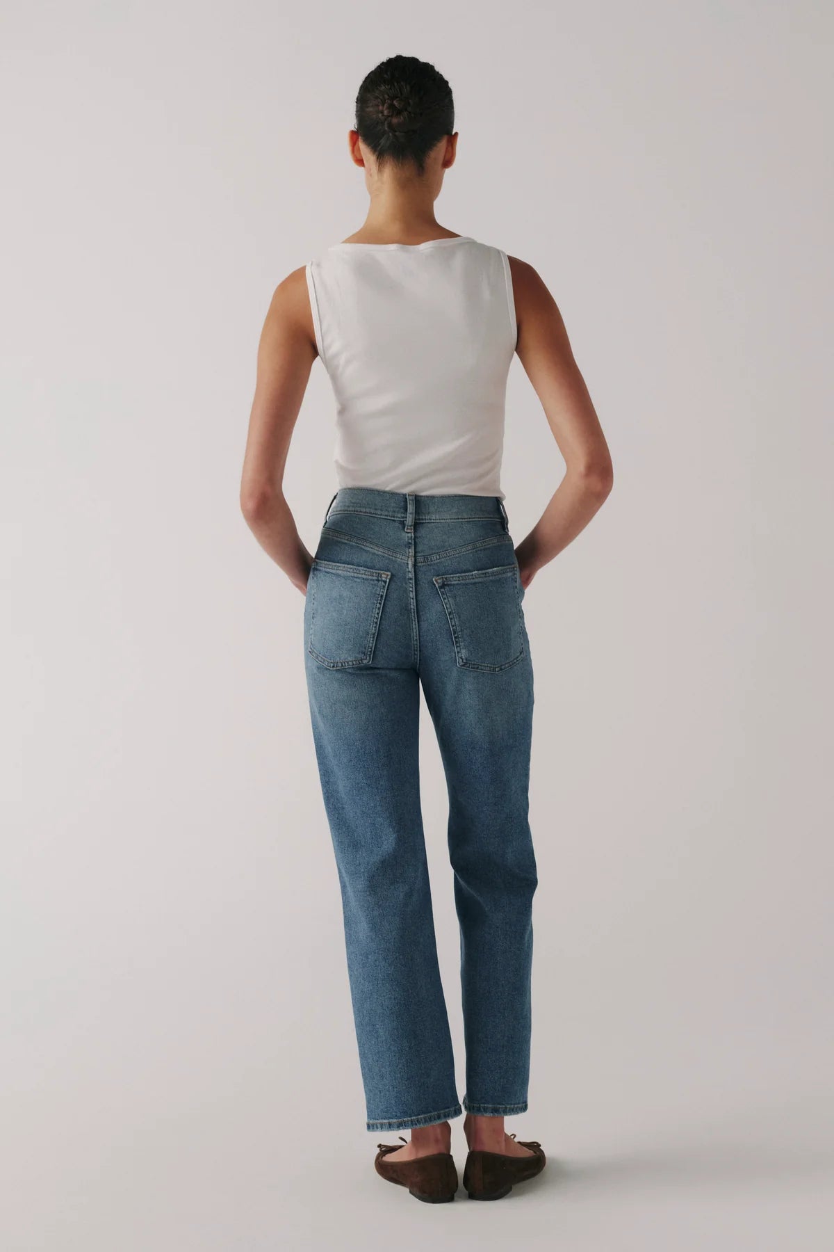 high rise straight denim pant with a medium wash