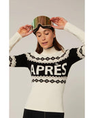 white and black sweater that says apres