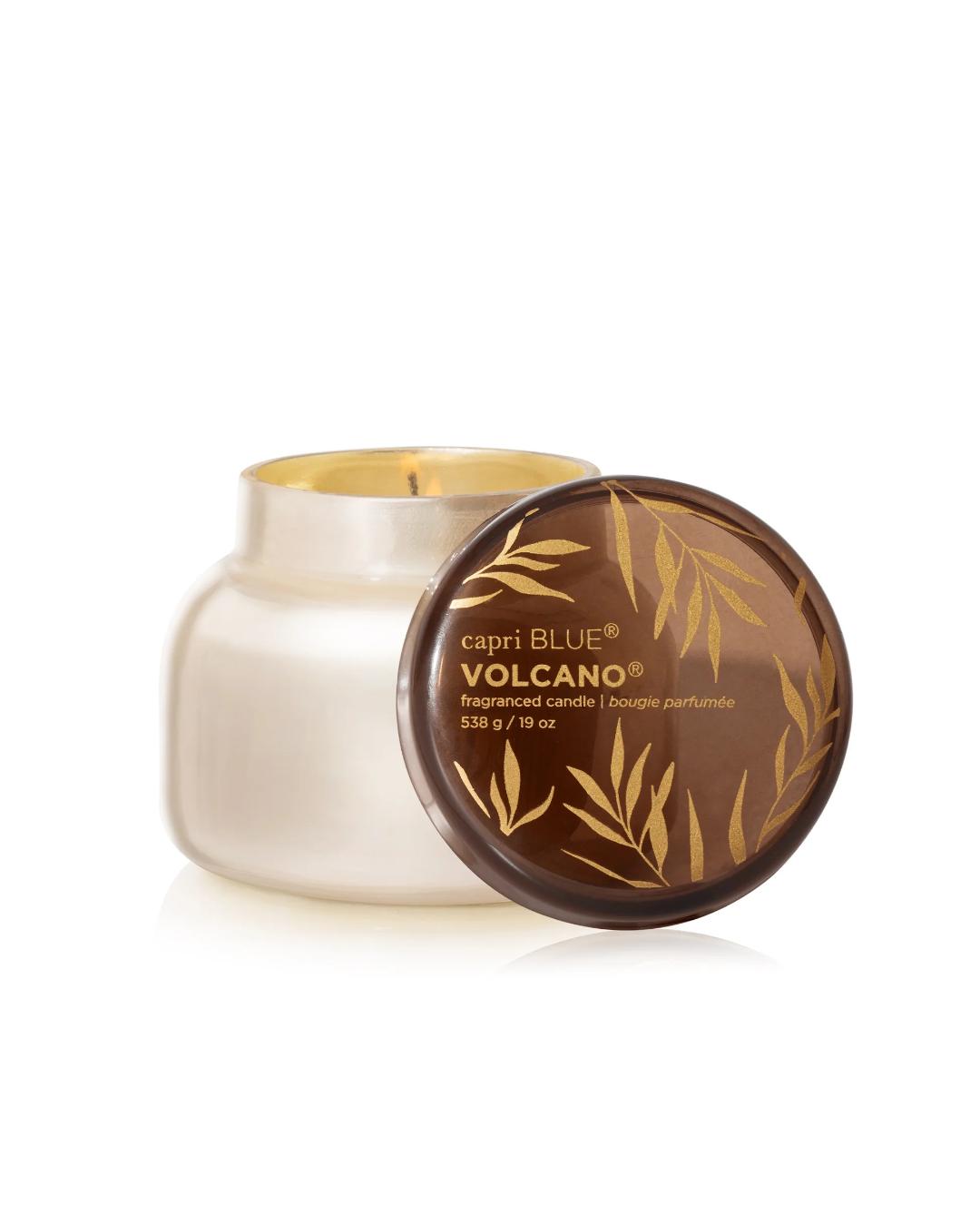 Capri Blue Volcano candle with lid on a white background