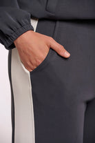 wide leg pant in dark navy with a cream stripe down the side