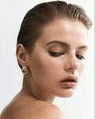 statement knot gold earrings