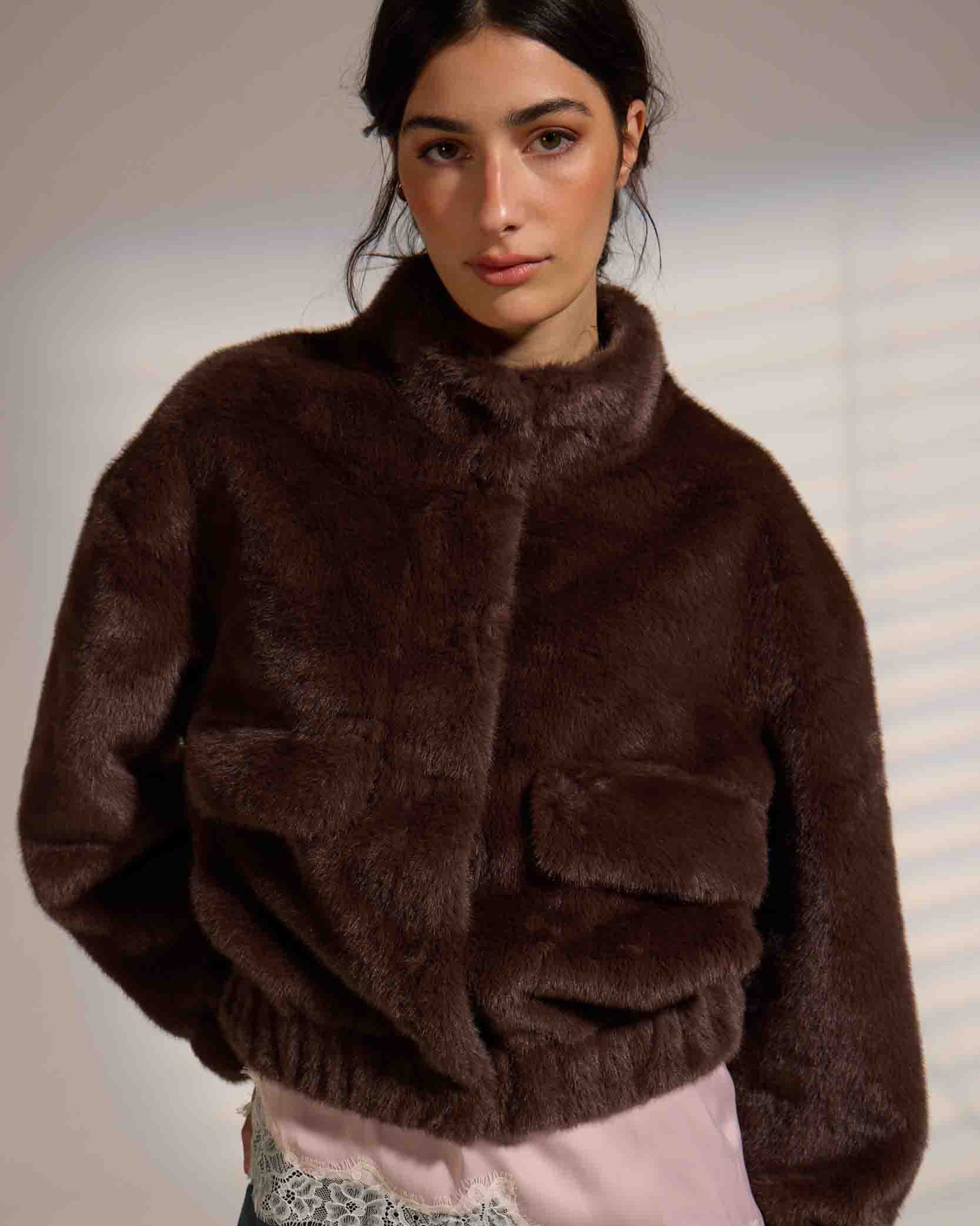 faux fur jacket in brown with fold over pockets and a highs collar