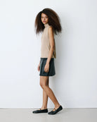 sleeveless gold knit top with tie at the back