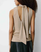 sleeveless gold knit top with tie at the back