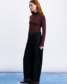 dark denim barrel jean with rolled cuff and plaid design