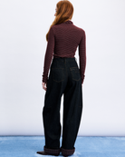 dark denim barrel jean with rolled cuff and plaid design