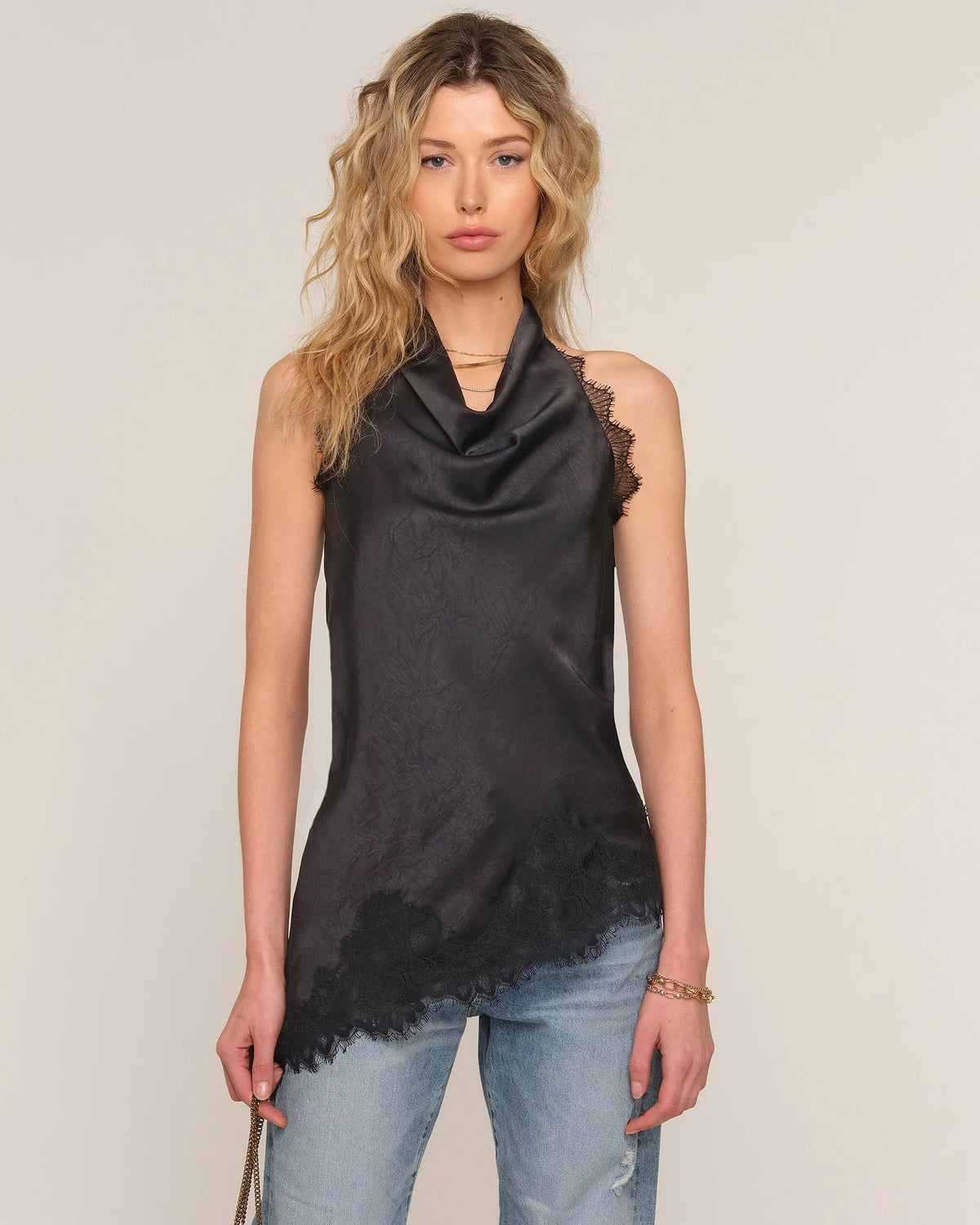 black cowl neck tank top with lace trim and a bias bottom