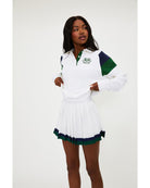 white polo long sleeve with navy and green stripe on the shoulders 