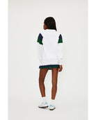 white polo long sleeve with navy and green stripe on the shoulders 