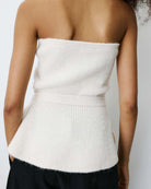 strapless tube top in white with peplum bottom and tie around the waist