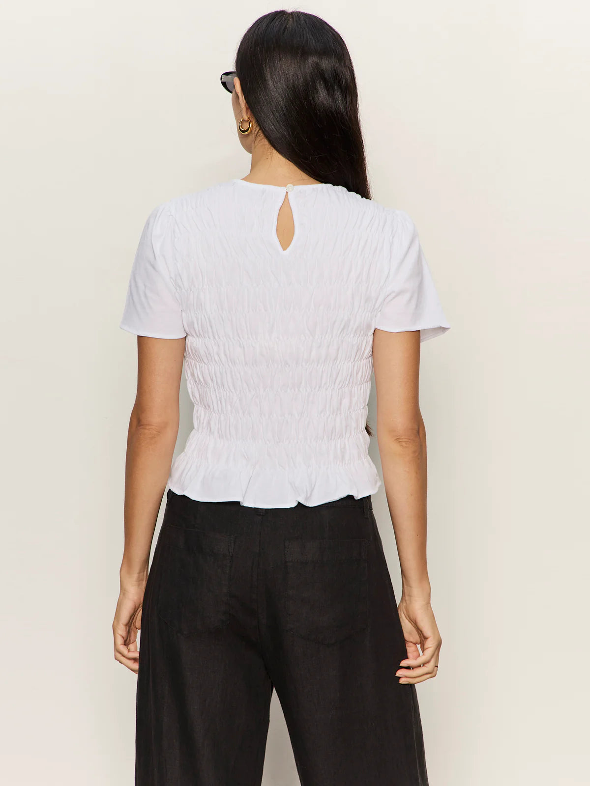 white top with smocking around the waist