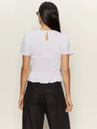 white top with smocking around the waist