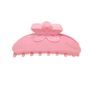 pink claw clip with a flower design on top