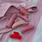 pink claw clip with flower on top