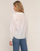 white blouse with lace trim on sleeves and collar