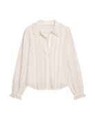 white blouse with lace trim on sleeves and collar