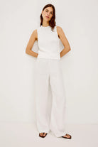 white sleeveless knit top
