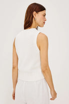 white sleeveless knit top