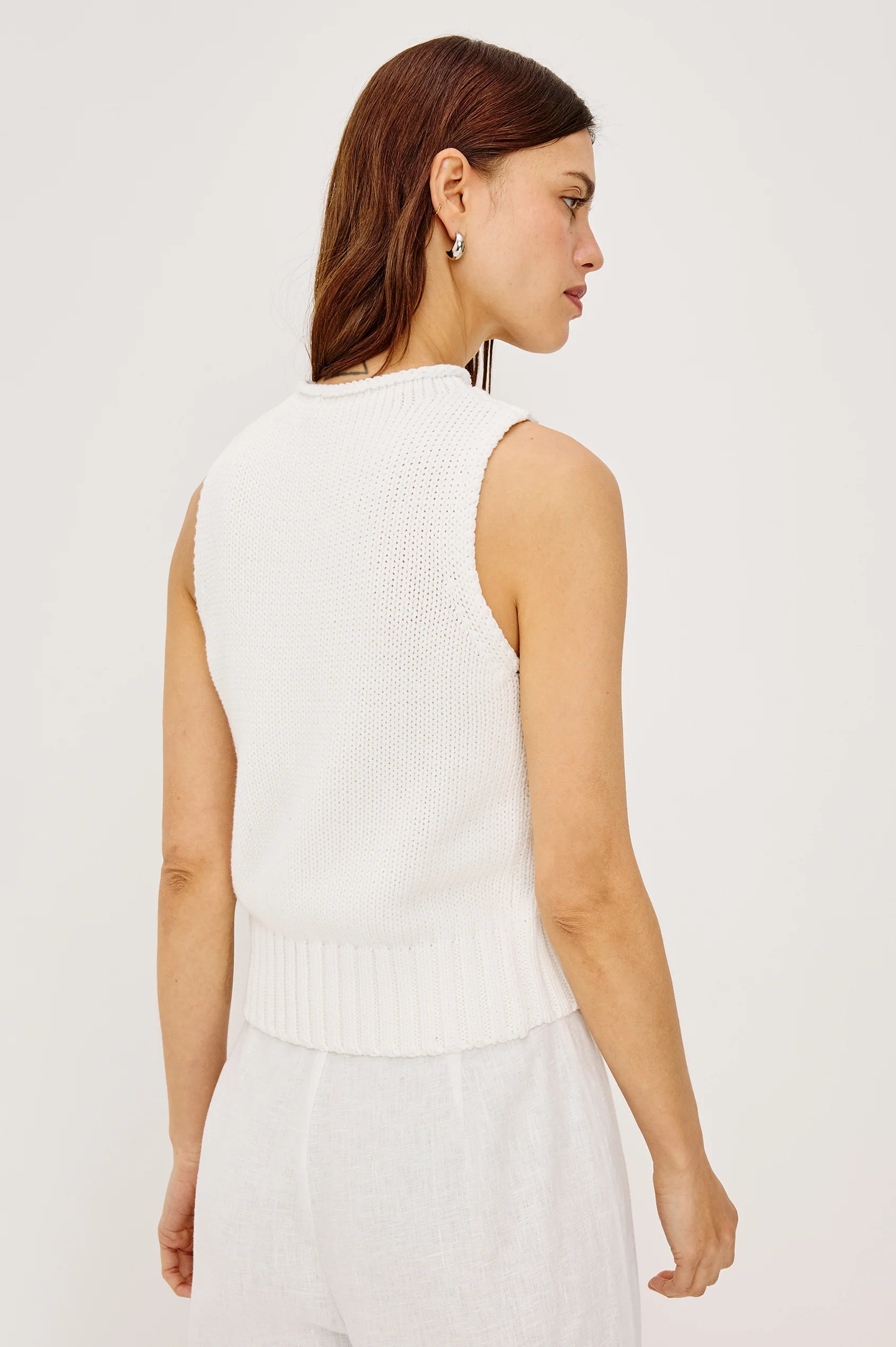 white sleeveless knit top