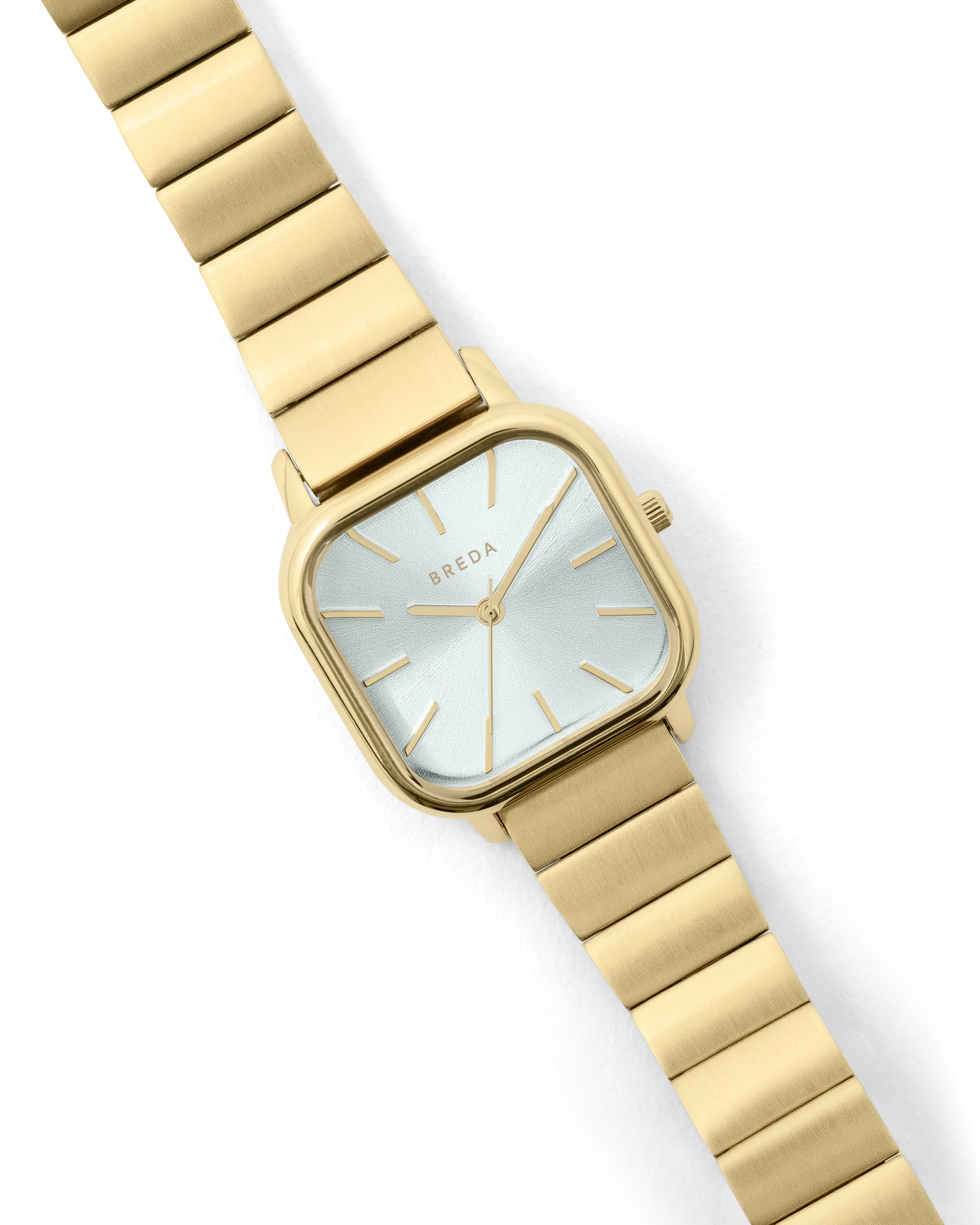 gold square face watch with pearl face