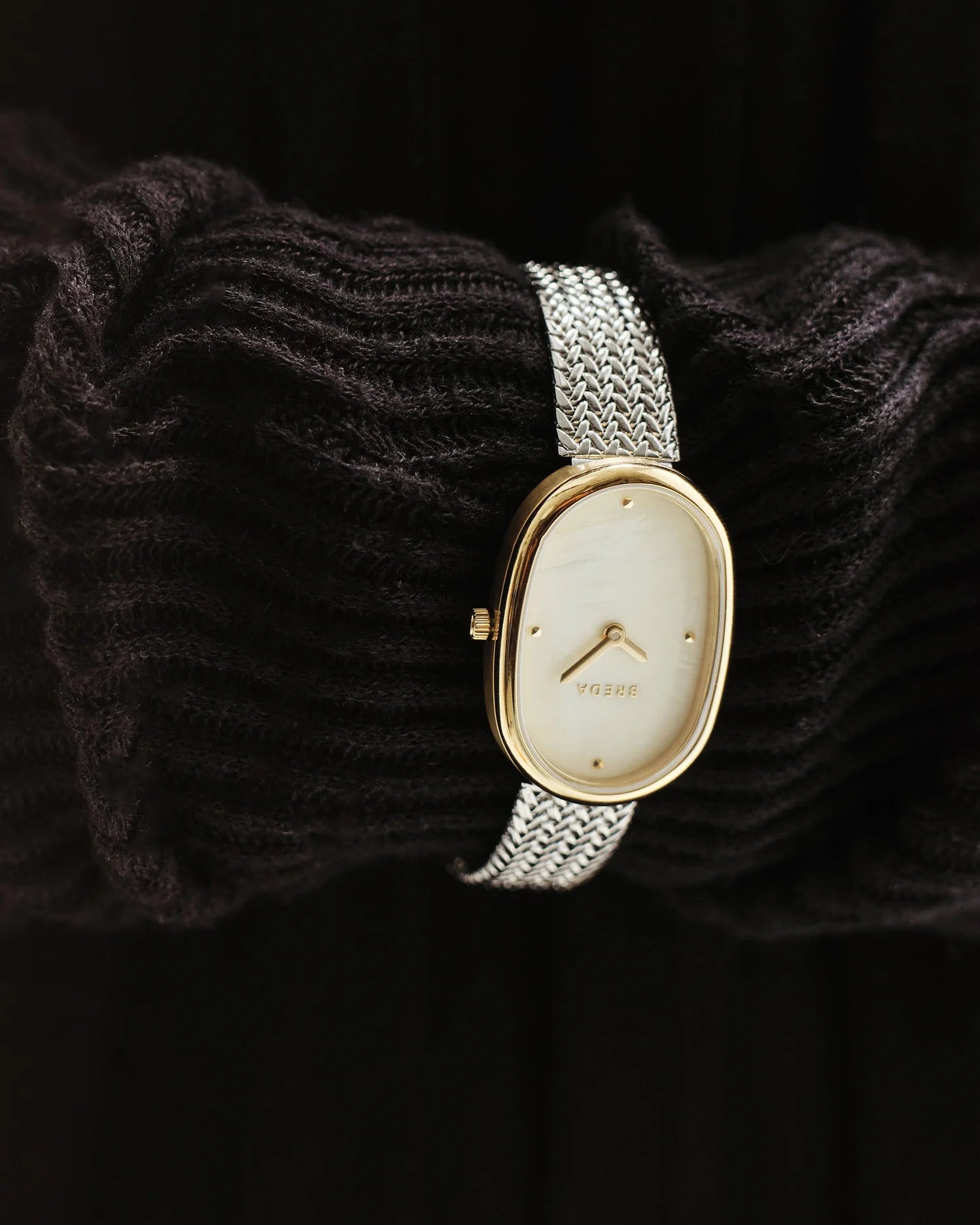 watch with silver band and gold face 