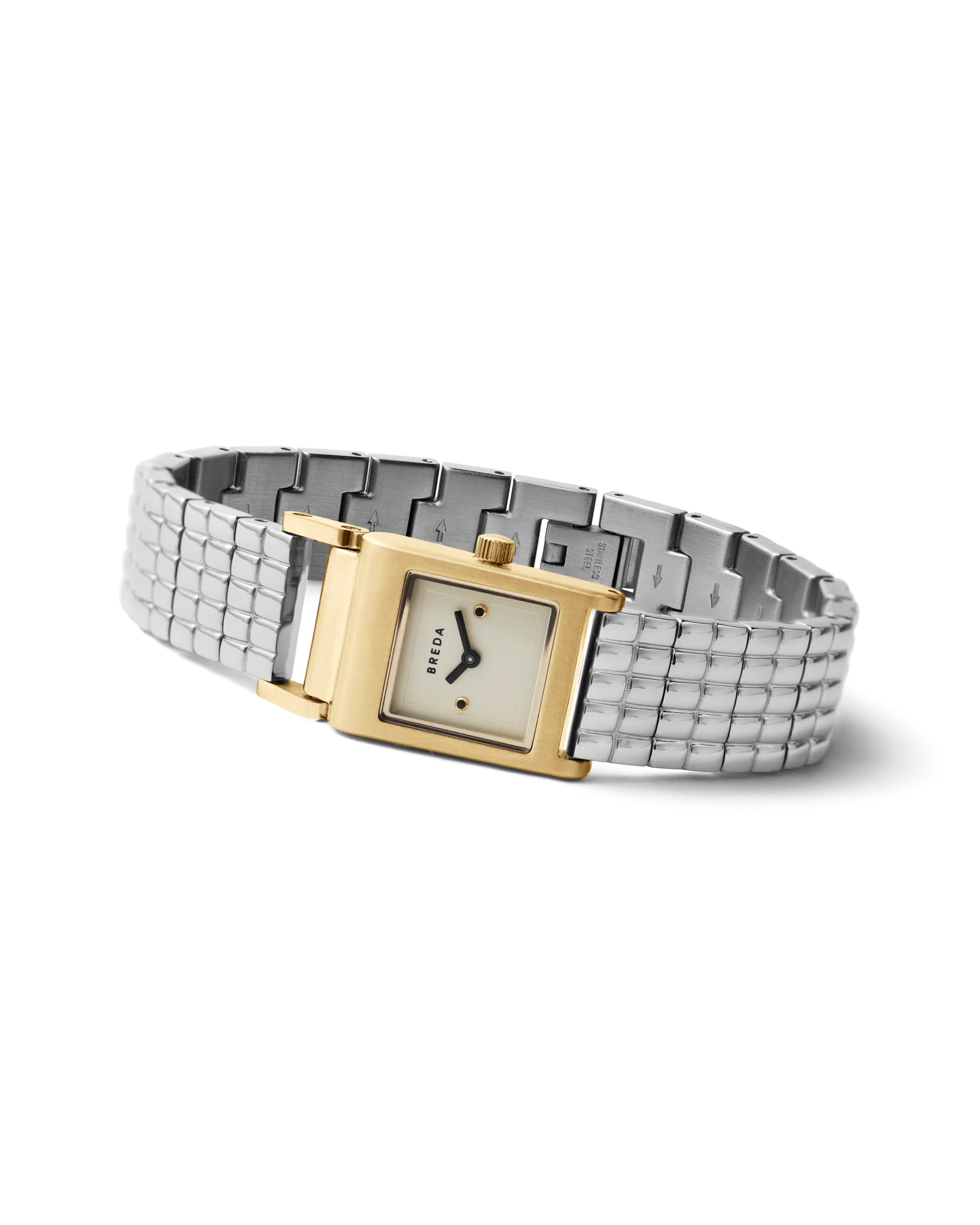silver band and gold face watch