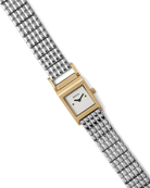 silver band and gold face watch
