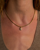 gold rope necklace with pear shaped diamond pendant 