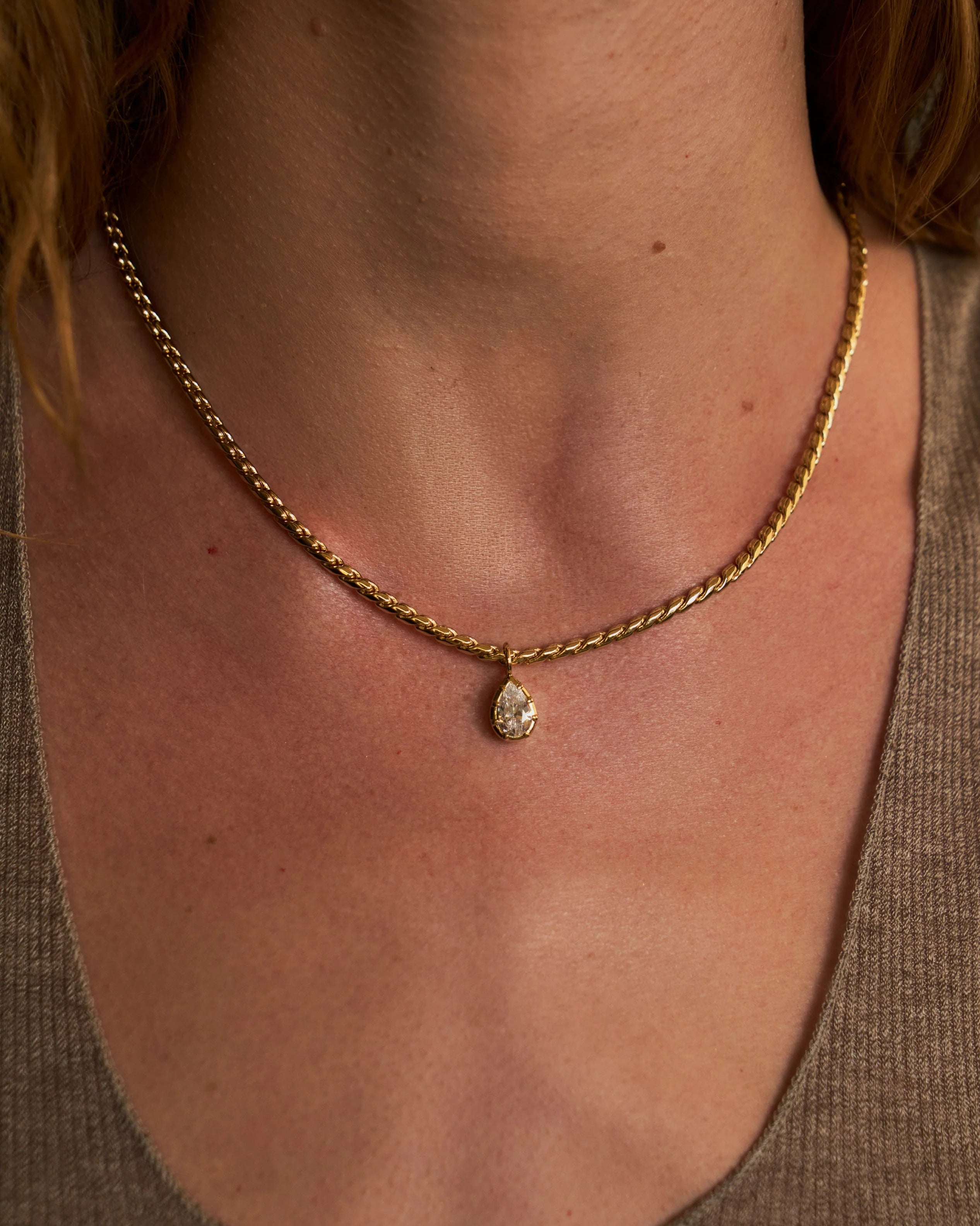 gold rope necklace with pear shaped diamond pendant 