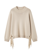 beige knit sweater with tassels on the sides