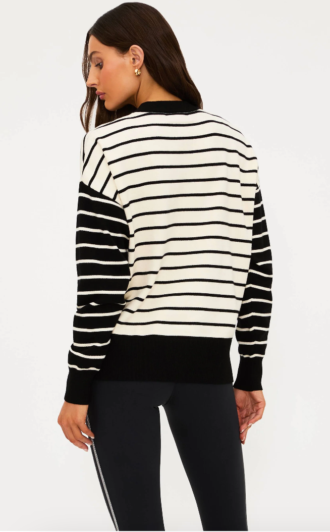 black and white stripe sweater with ski written in the middle