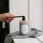 showing off a black candle snuffer