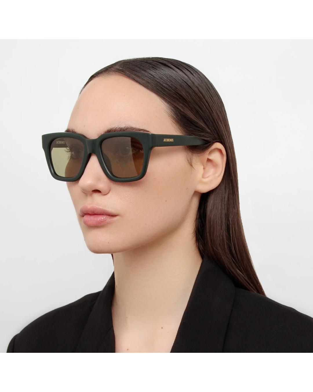 black square sunglasses with green lenses 