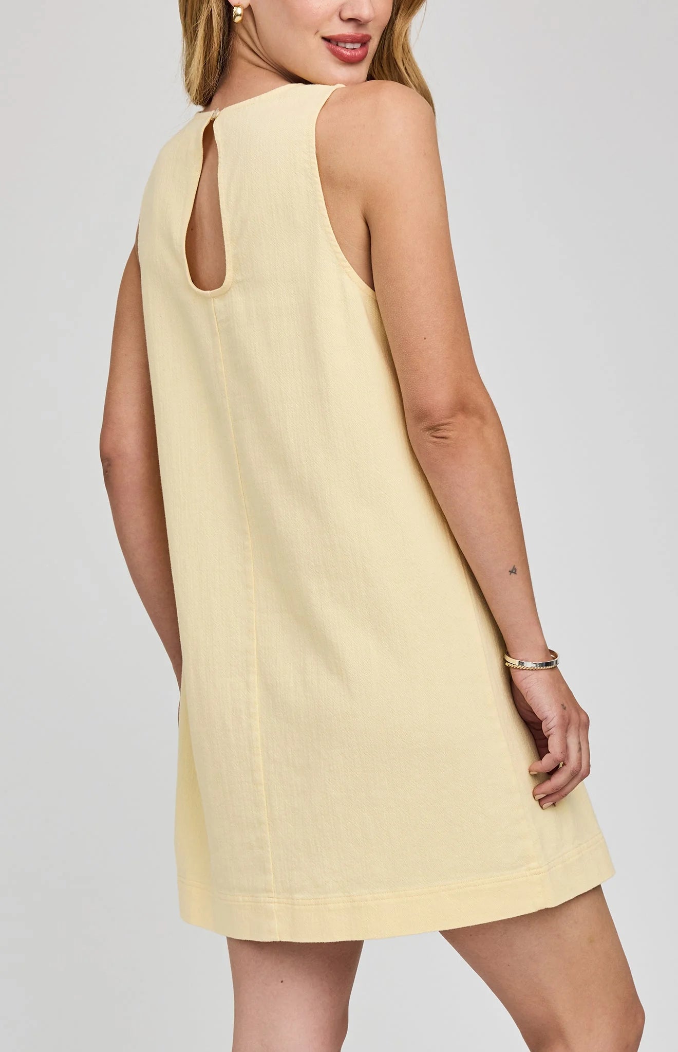 mini yellow dress with pockets on the front