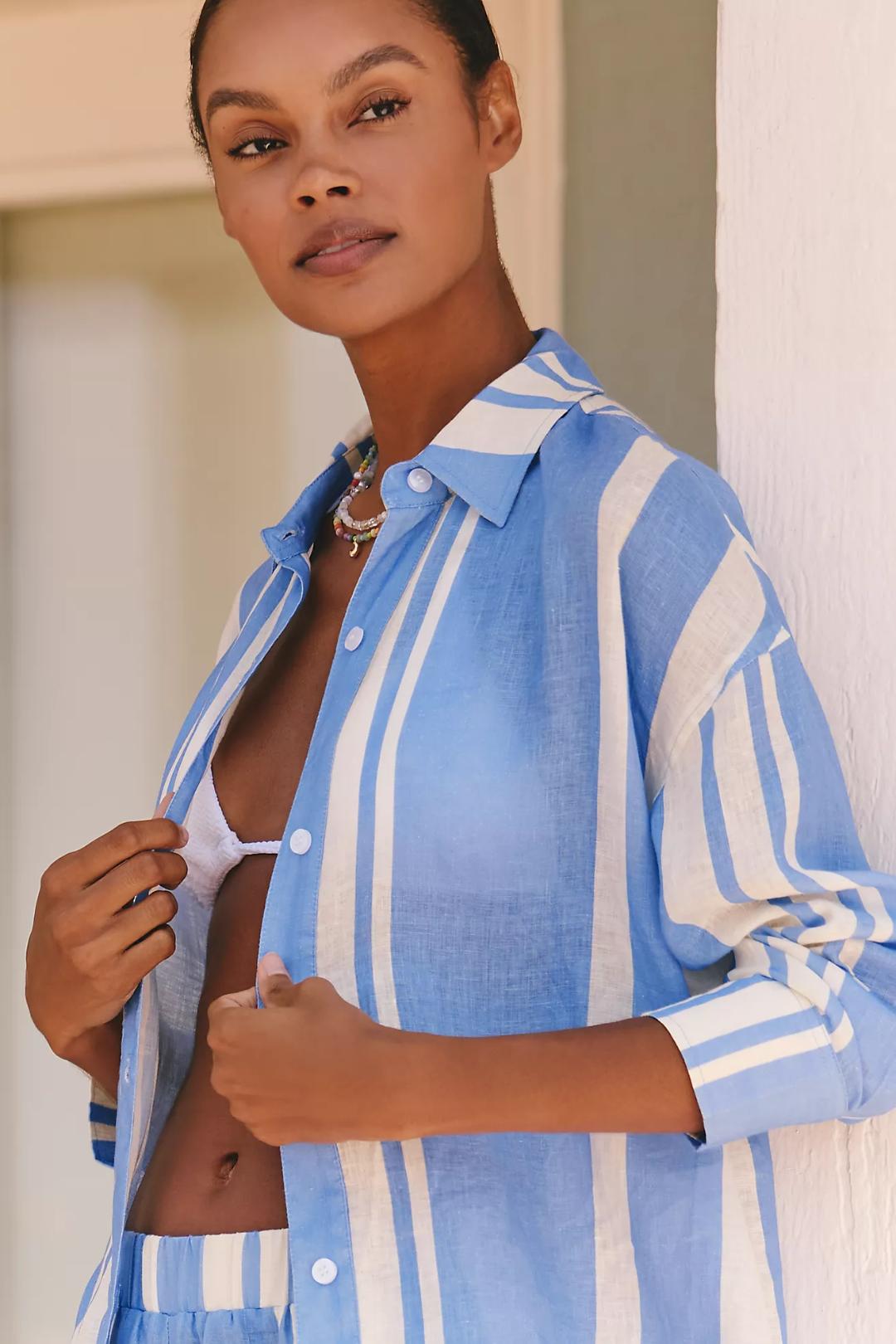 Woman wearing a blue and white striped shirt